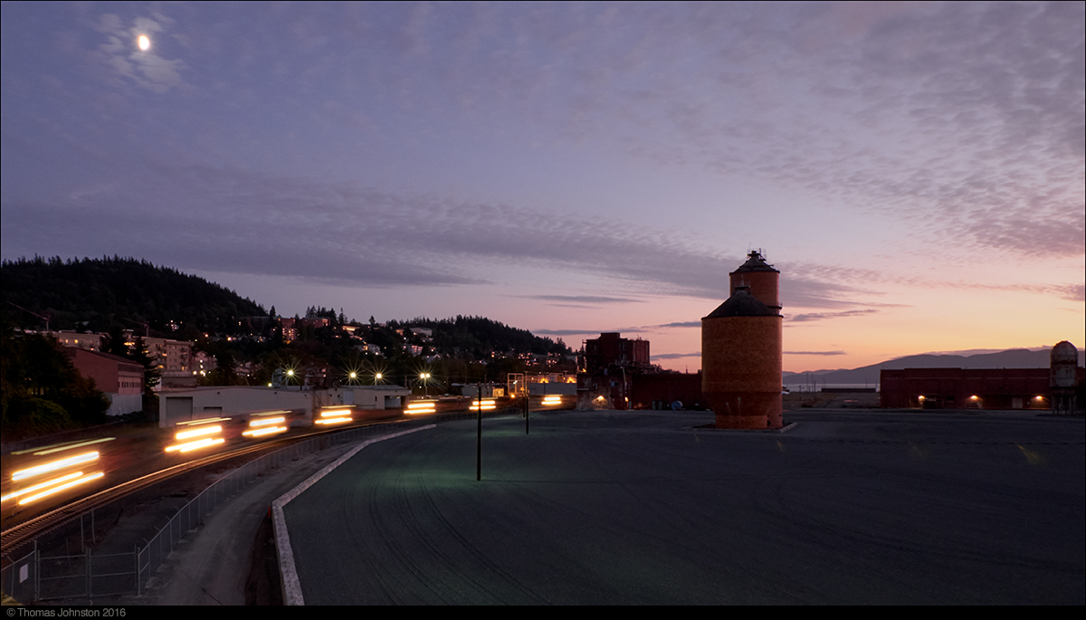 Coal train at night rumbles through Bellingham, Wa. near former pulp mill